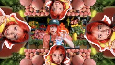 A colorful collage in the style of a kaleidoscope featuring a young white girl with bright red hair wearing a Jamba Juice hat surrounded by piles of fruit.