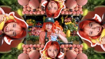 A colorful collage in the style of a kaleidoscope featuring a young white girl with bright red hair wearing a Jamba Juice hat surrounded by piles of fruit.